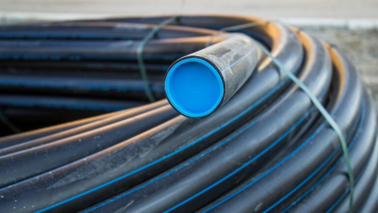 Coil of black industrial PVC hose