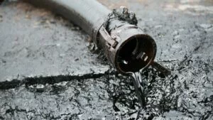 spill from industrial hose needing dry disconnect couplings
