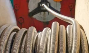 a coil of small industrial metal hose