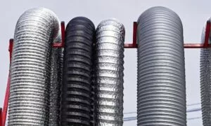 different industrial hose used for ducting hanging on a frame