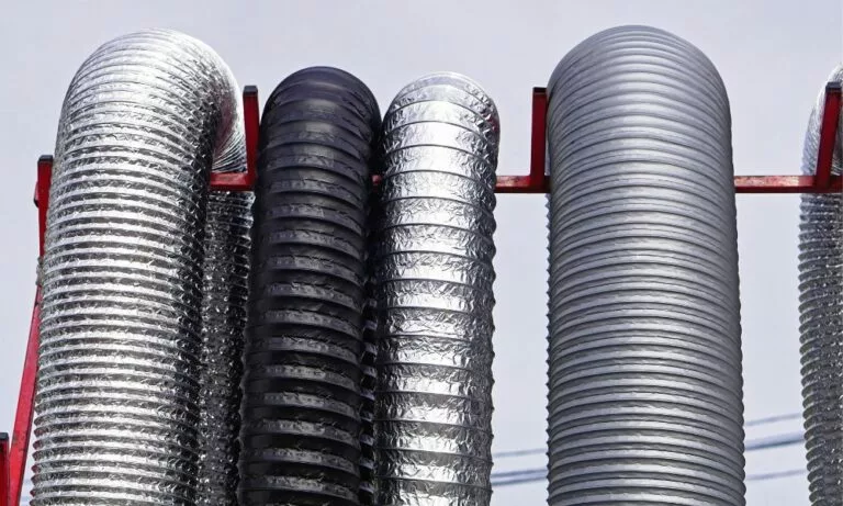 different industrial hose used for ducting hanging on a frame